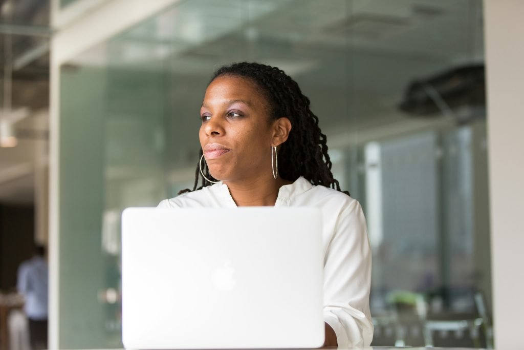 Woman working on laptop in modern office