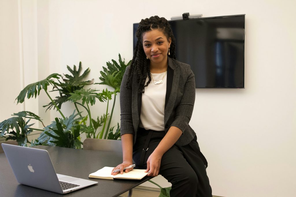 Smiling professional woman at office desk